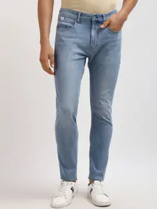 Calvin Klein Men Tapered Fit Low Distress Heavy Fade Jeans