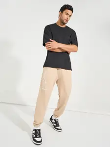 Styli Men Beige Slogan Typography Printed Oversized Fit Pure Cotton Joggers