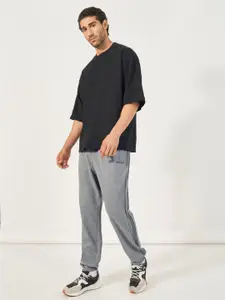 Styli Men Side Pintucks Oversized Fit Joggers with Embroidered Detail
