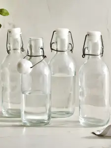 Home Centre Transparent Set of 4 Glass Solid Water Bottle