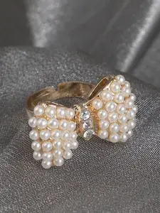 ANIKAS CREATION Gold-Plated White Stone & Pearl Studded Bow-Shape Adjustable Finger Ring