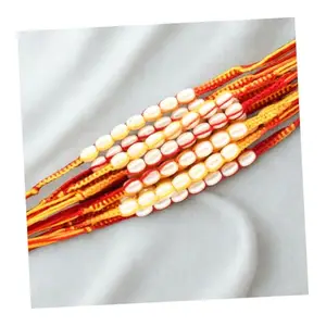 Natali Traders Moli Thread Rakhi for Brother Set of 12 White Pearl Beads Mauli Dhaga Kalava Rakhi for Men Traditional Dora Handmade Rakhis for Brothers, Bhaiya Rakhis with Roli Chawal (Pack of 12)