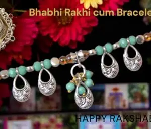 Be artistic studio Rushant Desinger Bhabhi Rakhi in Dori pattern in Silver Oxidised owl shape design with Rama Green colour crystels rakhi for Pyari Bhabhi - Gift of Roli chawal nd Pooja Thali - 60048