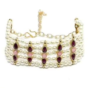 Karatcart Purple and Pink Stone Studded Pearl Beaded Kundan Bracelet for Women