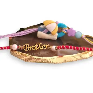 Ideaz unlimited Kids Rakhi Combo | Cute Beach Umbrella & 'Brother' Text Design | Pack of 2 with 1 Roli Chawal for Rakshabandhan Celebration (ID213)