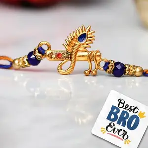 eCraftIndia Unisex Adult Blue & Golden Krishna Flute With Peacock Feather Designer Rakhi With Roli Chawal Pack And Raksha Bandhan Greeting Card - Rakhi For Brother