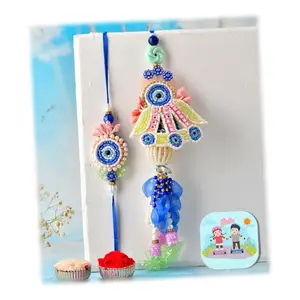 CraftVatika Premium Evil Eye Rakhi Set for Brother Bhabhi | Designer Rakhi Set for Bhaiya Bhabhi Evil Eye Lumba Couple Pair with Fridge Magnet Gift, Rakshabandhan Greeting Card, Tilak Set, Home decor