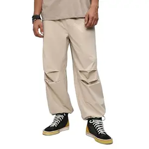 Campus Sutra Men's Off-White Solid Parachute Trousers for Casual Wear | 2 Pockets | Relaxed Fit | Elasticated Waist Closure | Pants Crafted with Comfort Fit for Everyday Wear