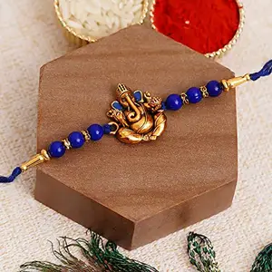 eCraftIndia Blue Pearl & Golden Lord Ganesha Rakhi with Roli Chawal Pack - Designer Rakhi for Brother