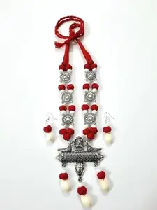 red and white jewellery with big ixidised pendant, very elegant, silver colour by Satrang Online